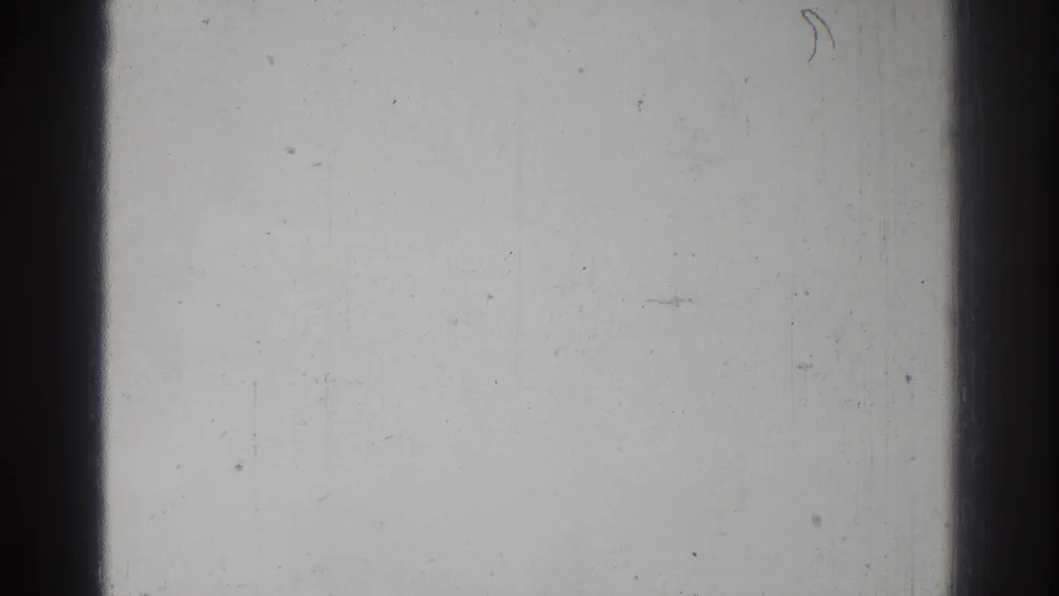Blank 8mm home-movie frame from the San Gabriel 1966 reel with dark frame edges, visible dust, scratches, and grain.