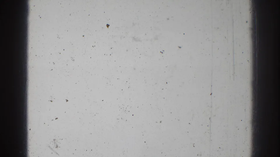 San Gabriel 1966 8mm home-movie frame showing blank film texture with dark vertical bars, dust, grain, and scratches.