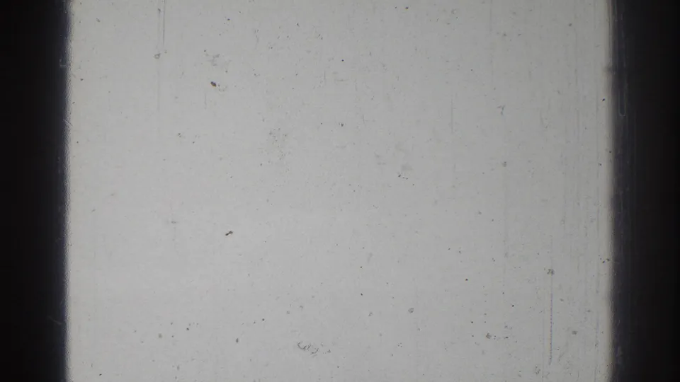 Overexposed 8mm frame from the 1966 San Gabriel home movie, dominated by pale film surface and a dark vertical frame boundary.