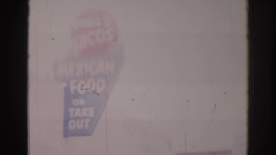 1966 Temple City frame with a tall sign reading partly as Mexican food or take out, a red circular logo shape, pale sky, and visible film wear.