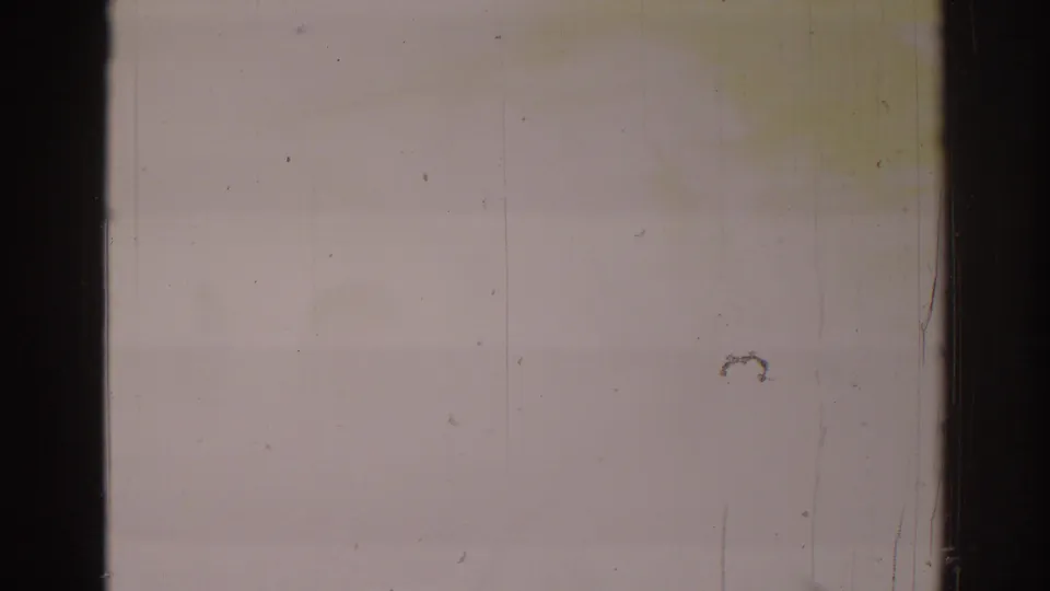 1966 Temple City 8mm frame with washed-out exposure, dark side edges, dust, scratches, and little readable scene detail.