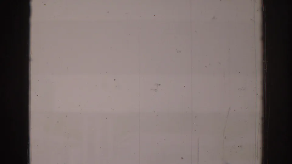 Overexposed 1966 8mm frame with pale film area, visible dust, scratches, and dark vertical frame bars.
