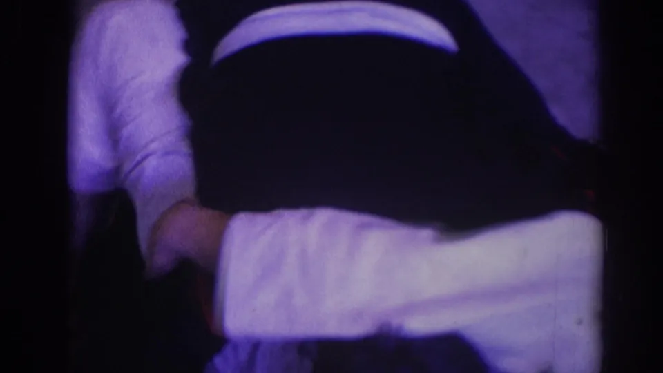 At the end of the 1966 Temple City wrestling sequence, a white-gi grappler appears to control an opponent on the floor in a tight cropped view.