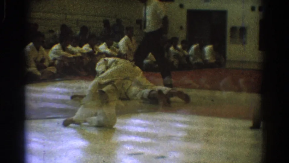 The final frame shows the 1966 karate match on the gym mat, with seated participants watching and a referee at the edge of the action.