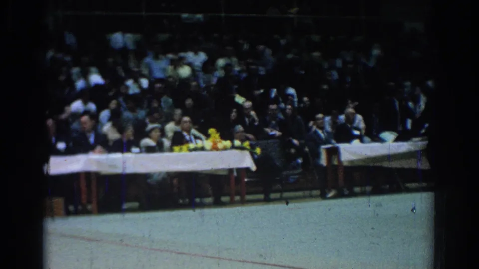 The final view shows the judges' or officials' table beside the mat at the 1966 West Covina martial arts event, with spectators behind it.