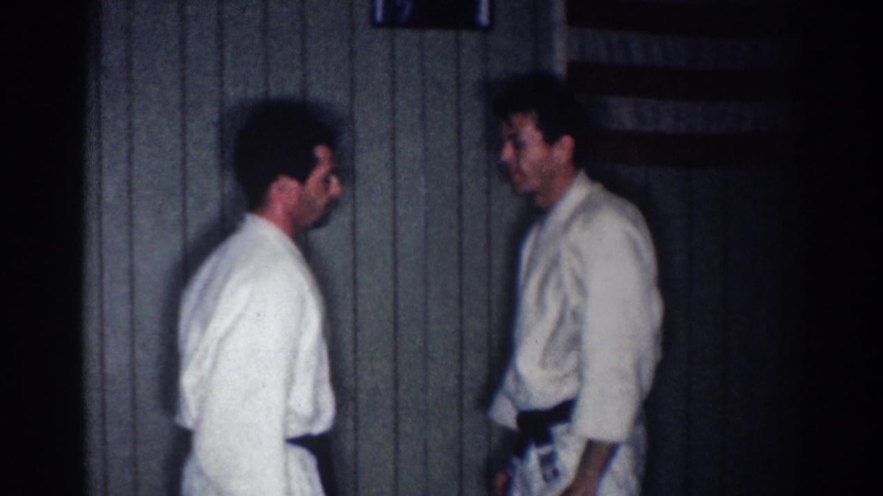 In the final frame, two adult judo practitioners stand facing each other indoors against the dark paneled background.