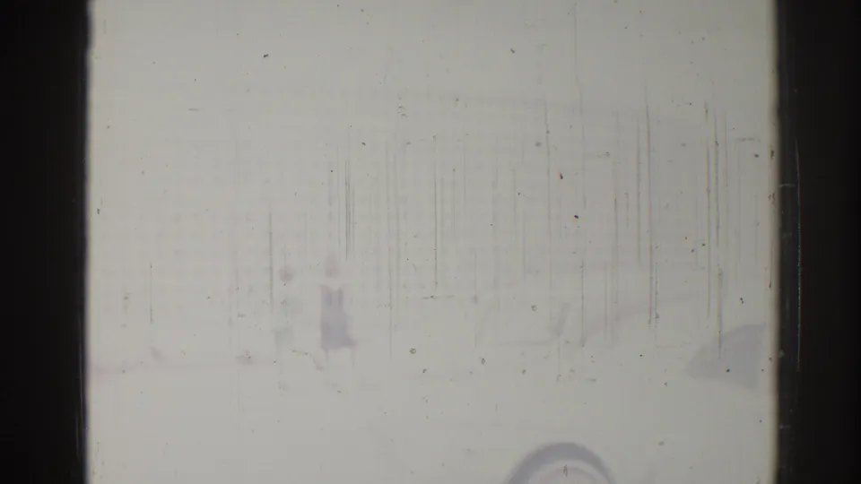 1967 Los Angeles roadside view through rain-streaked glass, with a possible distant person or object near the road.