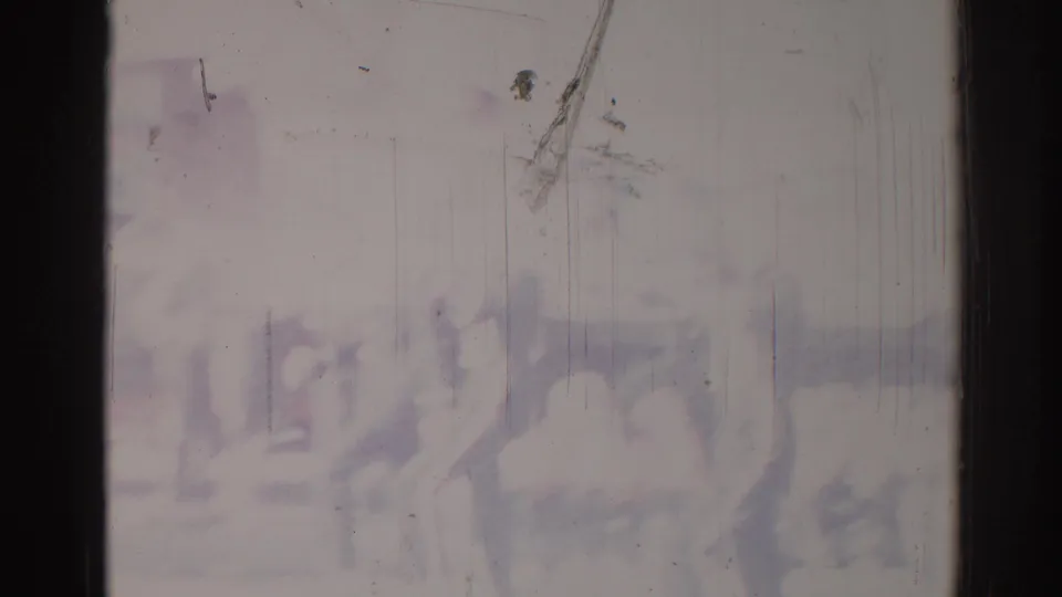 1967 Los Angeles home-movie frame with faint silhouettes that may show people marching or gathering, heavily obscured by haze and film wear.