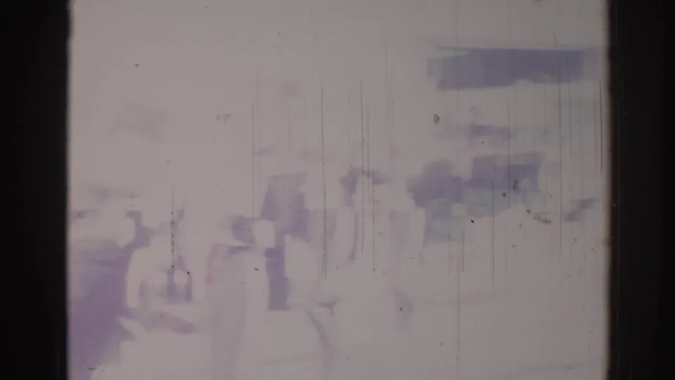 Hazy 1967 Los Angeles frame with indistinct people in a possible parade or band scene, softened by exposure, scratches, and color fading.