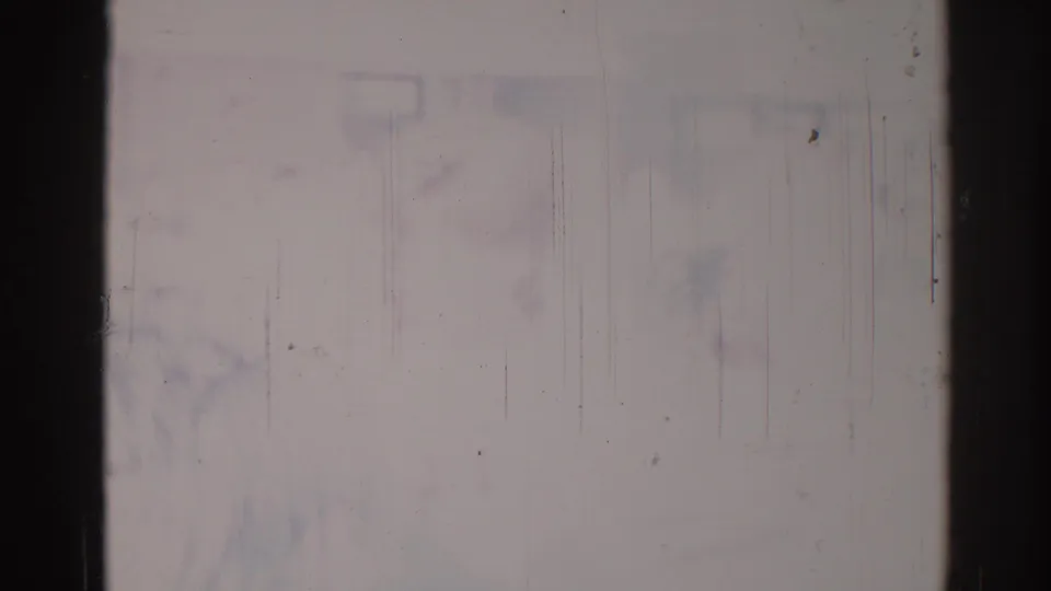 1967 Los Angeles 8mm home-movie frame reduced to a bright washed field with gate borders, scratches, dust, and faint discoloration.
