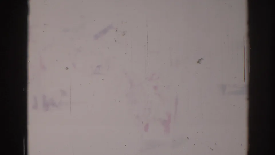 Washed-out 1967 Los Angeles 8mm frame showing a horse and rider moving through a bright street scene.