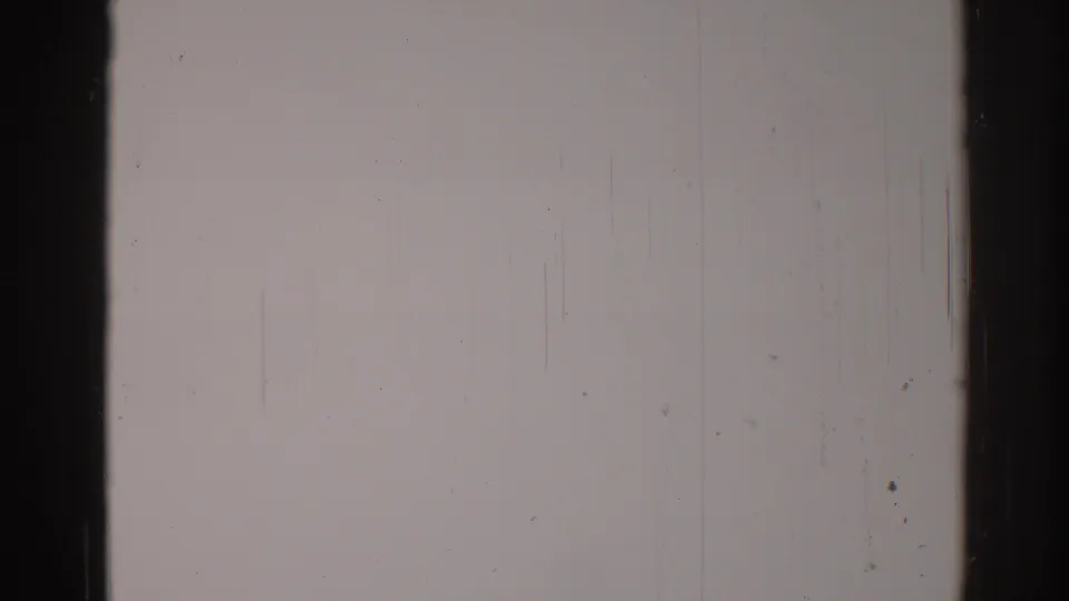 1967 Los Angeles 8mm frame showing a blank lower film area with a dark vertical strip, dust, scratches, and visible analog grain.
