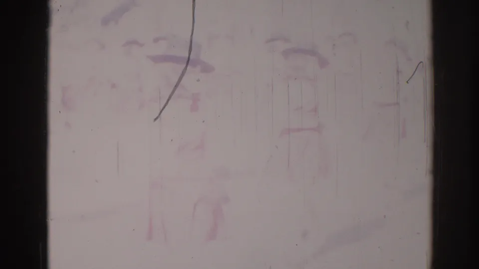 Faded 1967 Los Angeles 8mm frame with indistinct people and marching shapes barely visible through scratches and color loss.