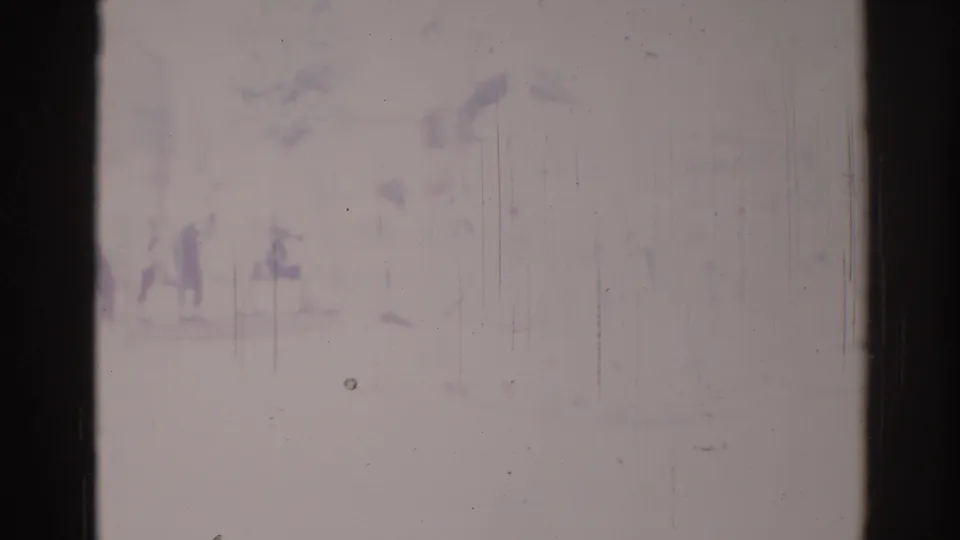 Overexposed 1967 Los Angeles-area home-movie frame showing faint spectators or parade participants near a commercial street.