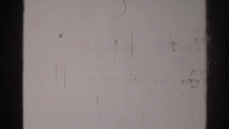 Faded end frame from the 1967 Los Angeles dance clip, with faint figures and strong 8mm surface wear.