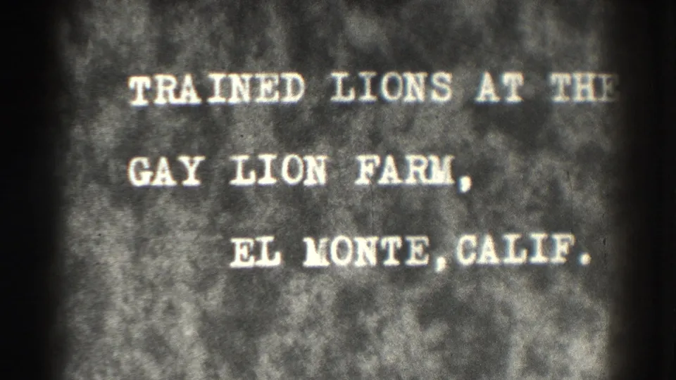 The title card remains on screen, naming the Gay Lion Farm in El Monte, California, with soft 8mm grain and edge darkening.