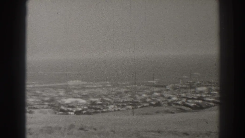 The final frame shows a hazy 1937 Long Beach coastal panorama with city blocks below and ocean beyond.