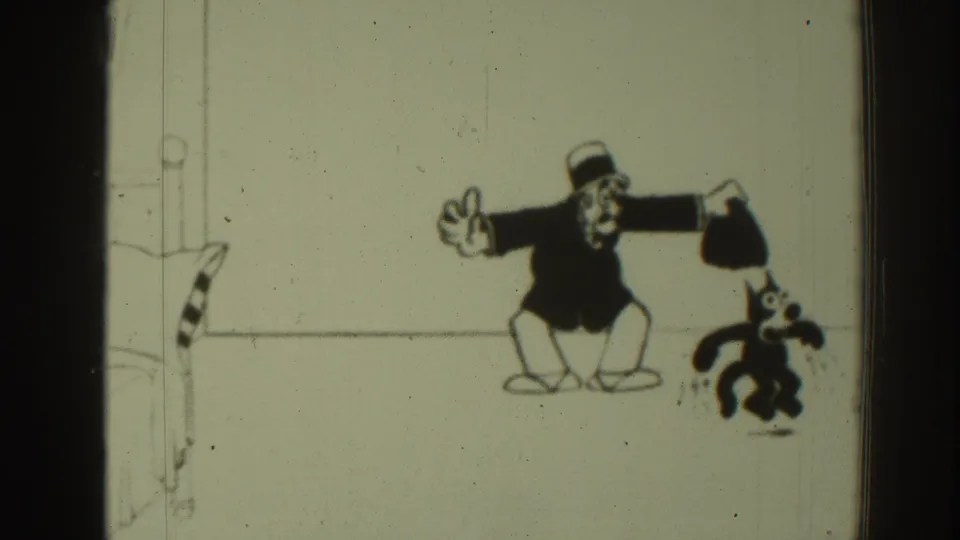 A top-hatted cartoon man holds the black cat by its tail in a comic gag from the 1937 Sacramento home-movie animation.