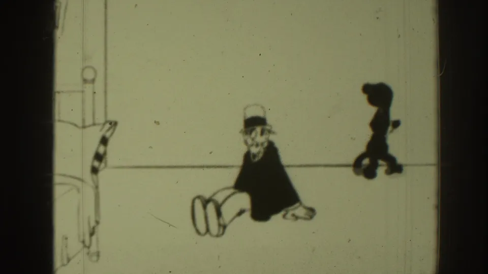1937 8mm cartoon frame showing the seated top-hatted man at left and a blurred black cat shape at right, with dust and scratches.