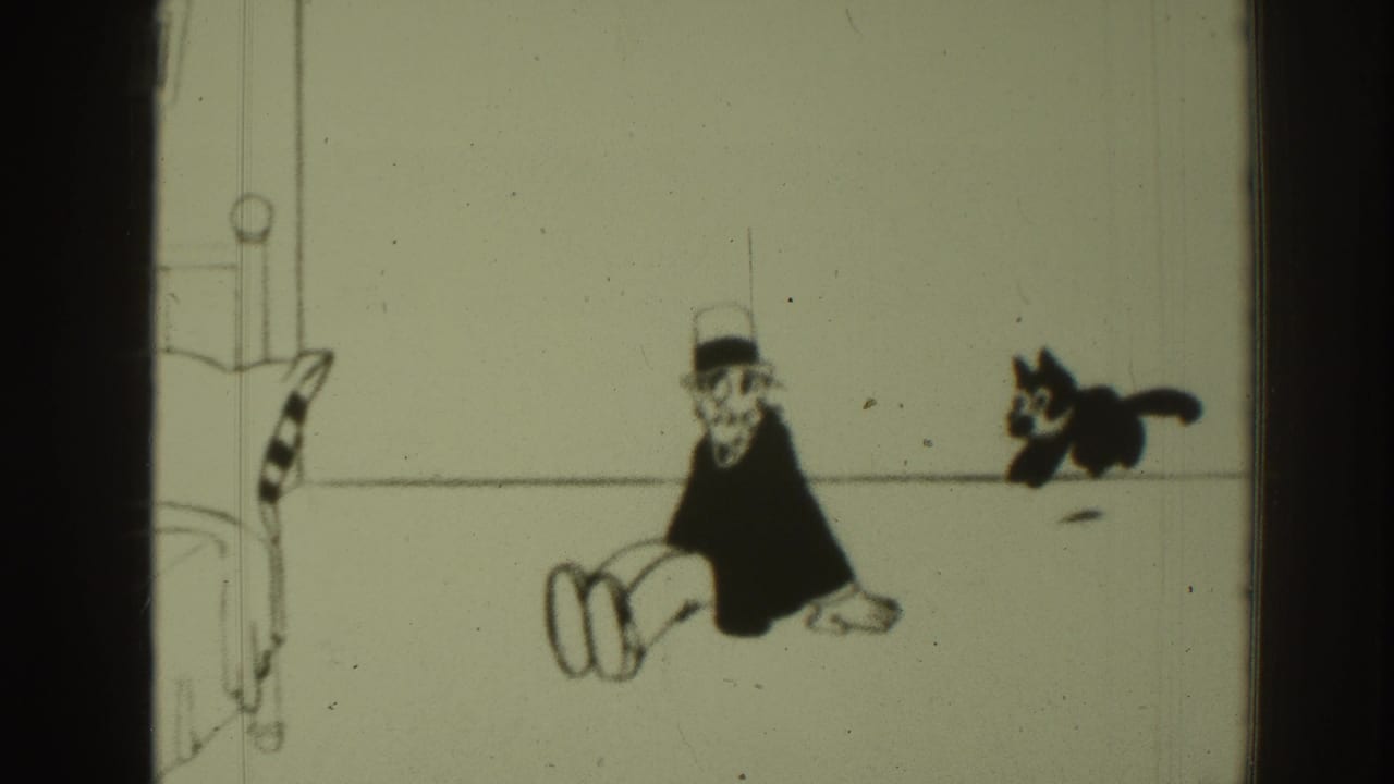 Felix the Cat leaps behind a seated top-hatted cartoon man in a sparse room.