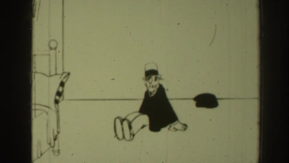 1937 Sacramento-linked 8mm frame showing the top-hatted cartoon man seated in profile with a small dark object on the floor nearby.