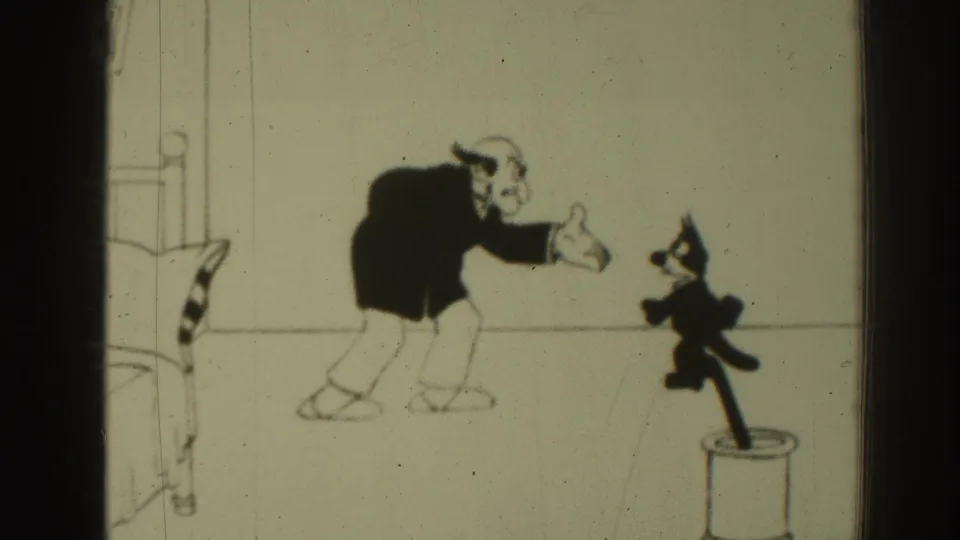 1937 8mm Felix the Cat cartoon frame showing a man reaching toward Felix above a bold question caption.