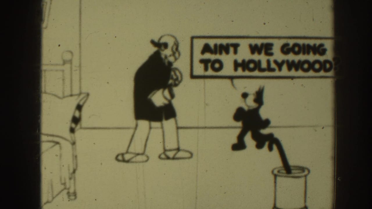1937 Sacramento 8mm frame showing a cartoon cat addressing a balding man in a drawn bedroom with a speech bubble about Hollywood.