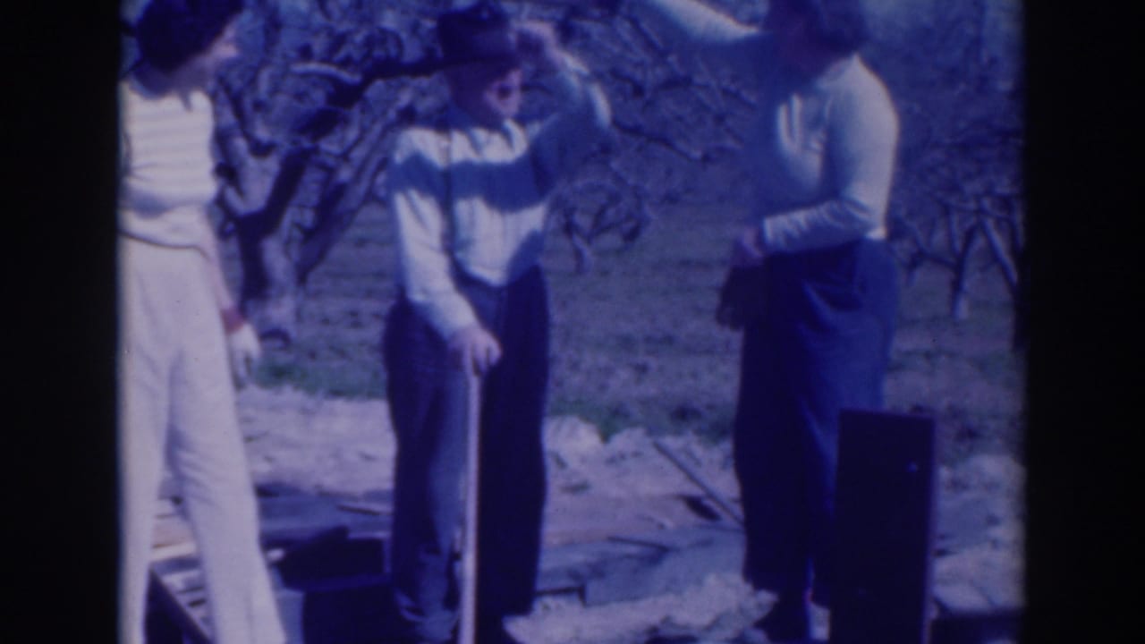 The 1937 Sacramento frame shows two women and a man in a fedora outdoors, with one woman gesturing toward him near bare branches.