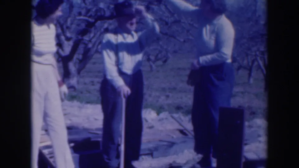The 1937 Sacramento frame shows two women and a man in a fedora outdoors, with one woman gesturing toward him near bare branches.