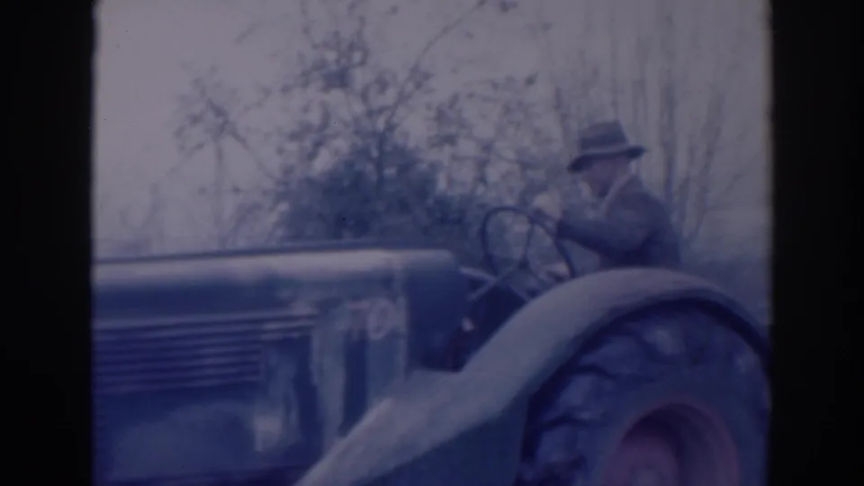 1937 Sacramento frame showing the tractor moving through the shot with the operator seated above the large rear wheel.