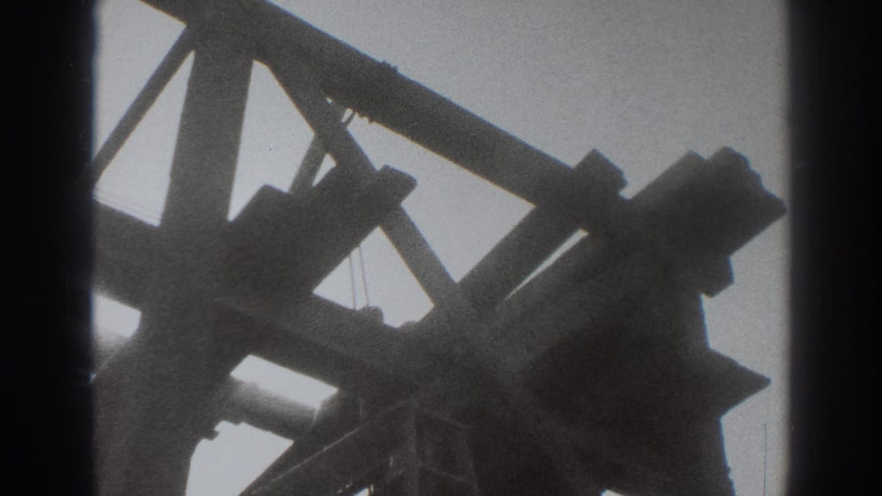 Low-angle silhouetted wooden framing against a bright sky.