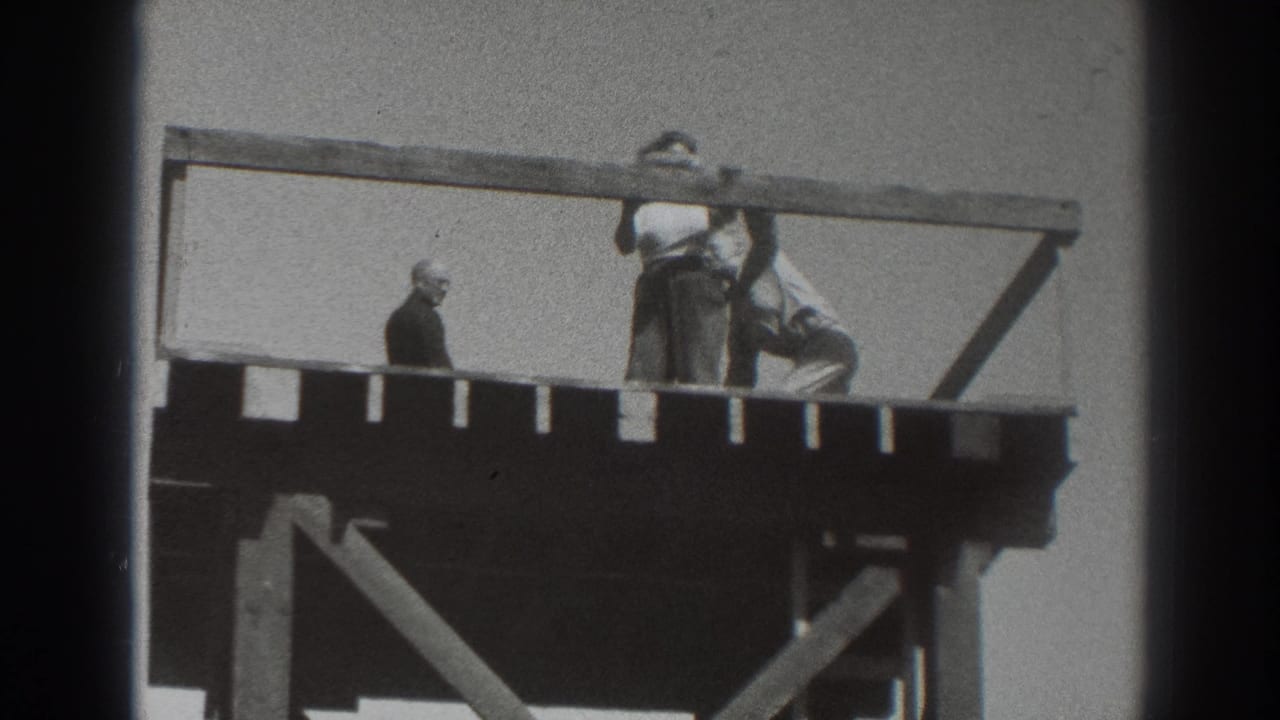 1937 Sacramento frame with people gathered on a timber observation platform, one figure standing apart and others near the rail.