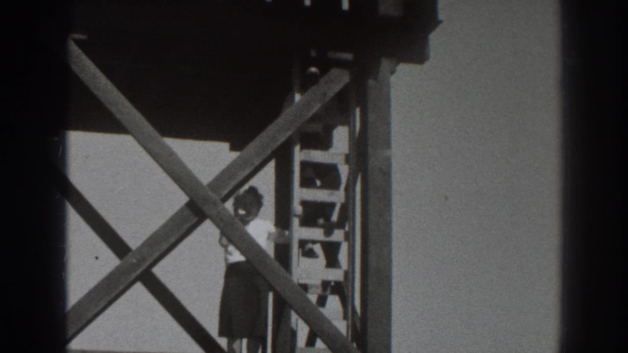 The final frame shows the woman beside the ladder beneath the platform, with strong diagonal wood beams across the view.