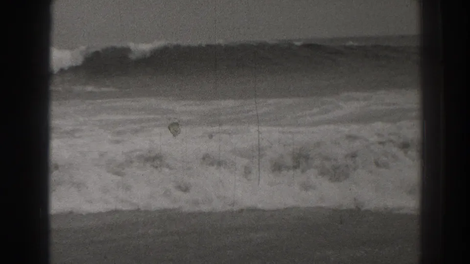 1937 Santa Cruz coastal frame with a curling wave cresting across rough water, softened by grain and exposure variation.