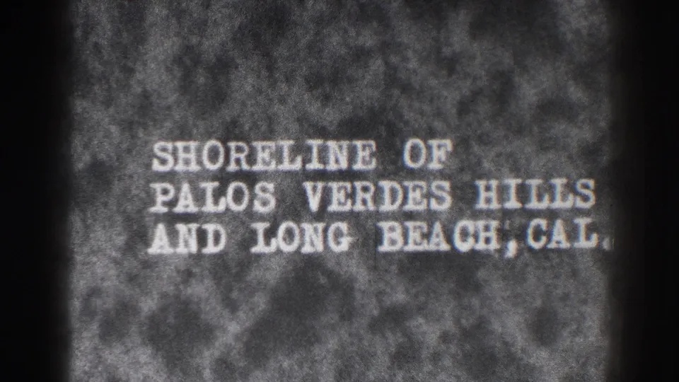 Black-and-white title card identifies the shoreline of Palos Verdes Hills and Long Beach, California.
