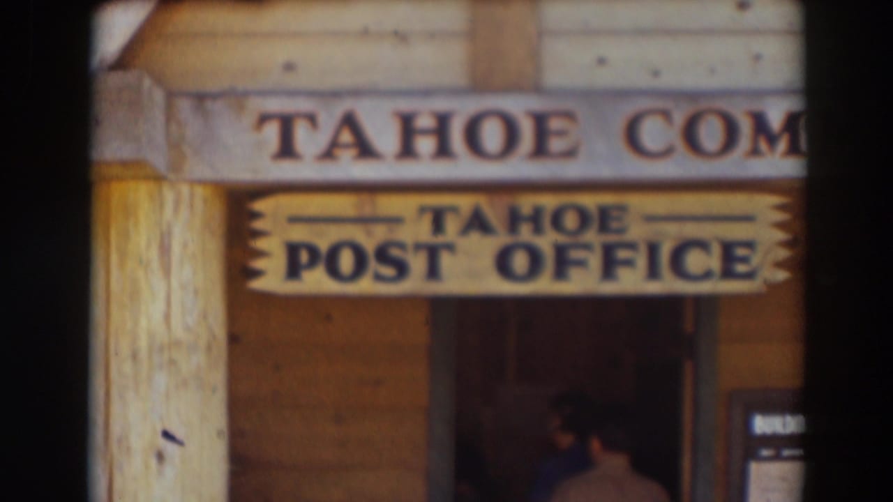 A wooden building front in Truckee shows a Tahoe Post Office sign beneath partially visible Tahoe Com lettering.
