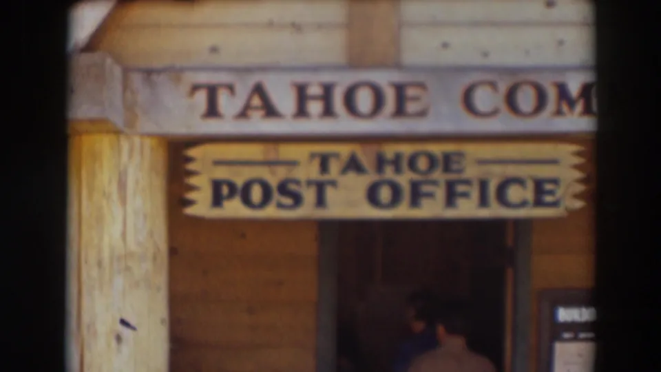 A wooden building front in Truckee shows a Tahoe Post Office sign beneath partially visible Tahoe Com lettering.