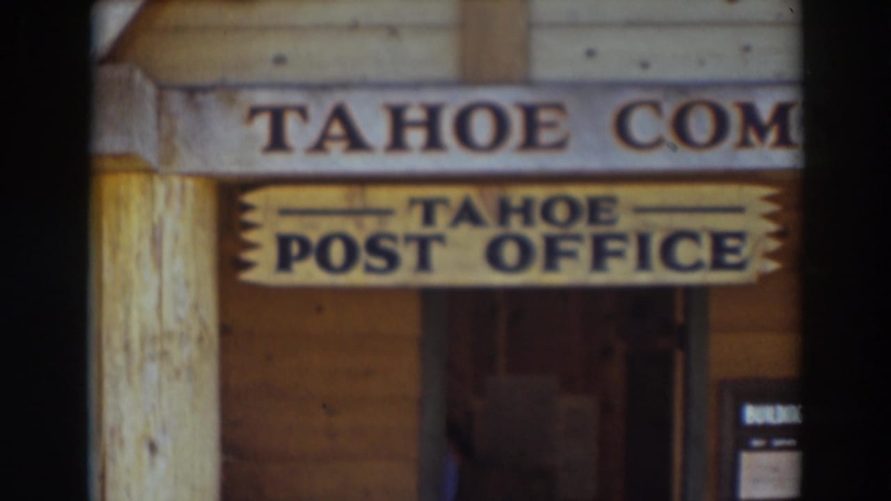 Final frame of the wooden Tahoe Post Office frontage in Truckee, California, with signage, doorway, and posted notice visible.