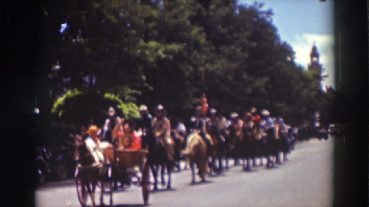 A horse-drawn carriage with passengers moves past riders on a tree-lined Truckee street during the 1937 parade.