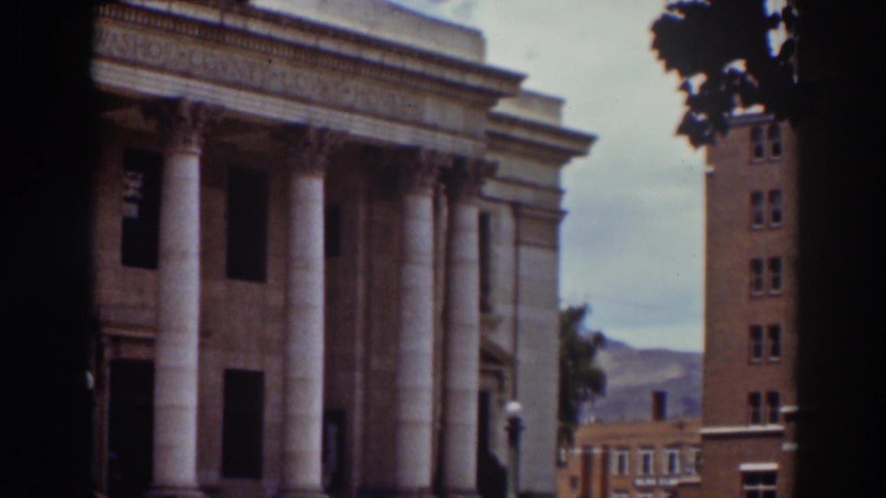 Final frame of the Truckee courthouse view, with the portico partly obscured by the film divider and town buildings visible to the right.