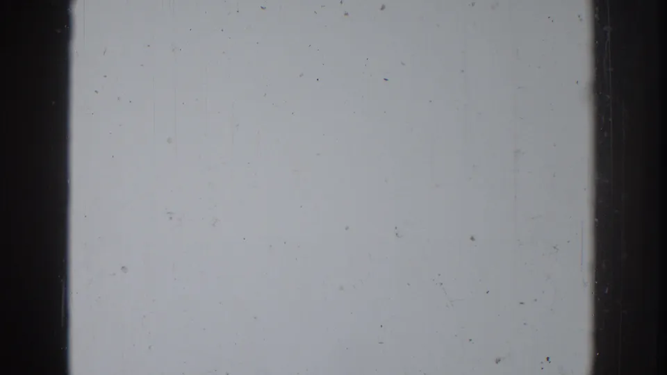 Overexposed 8mm frame from the 1937 Vacaville home movie, showing pale washout, film specks, and dark frame edges.