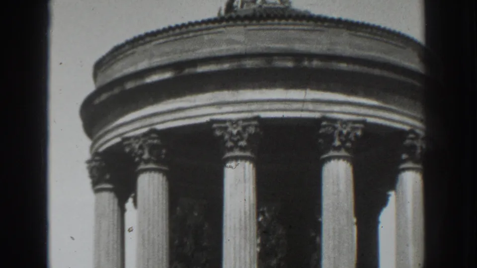 Final 1937 Vacaville frame showing the upper monument, rounded cornice, fluted columns, and high-contrast sky.