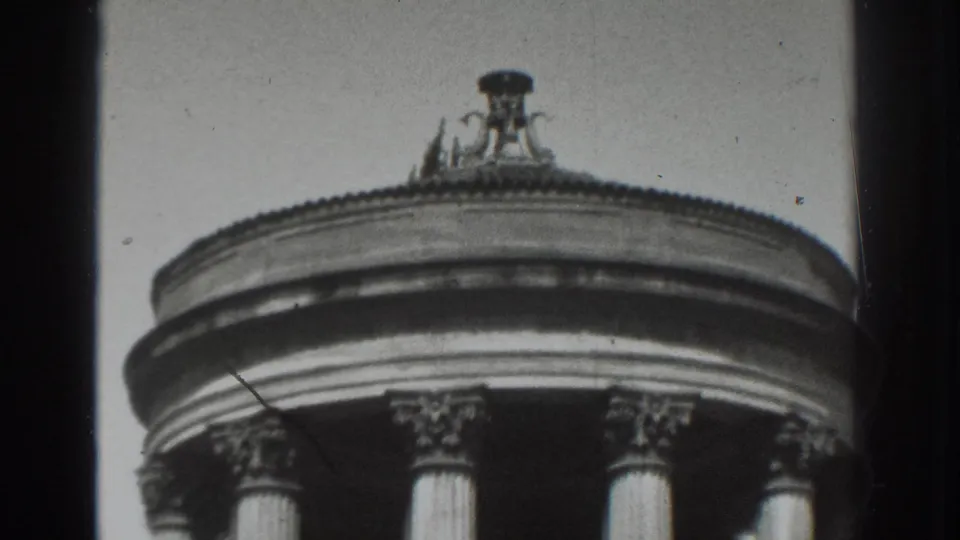 Black-and-white 8mm frame from Vacaville showing a classical rotunda roof, Corinthian-style capitals, and visible film gate edges.