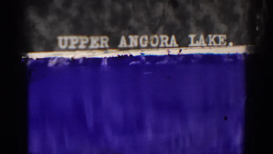 1938 Angora Lakes home-movie frame with an Upper Angora Lake title card and dark 8mm film borders.