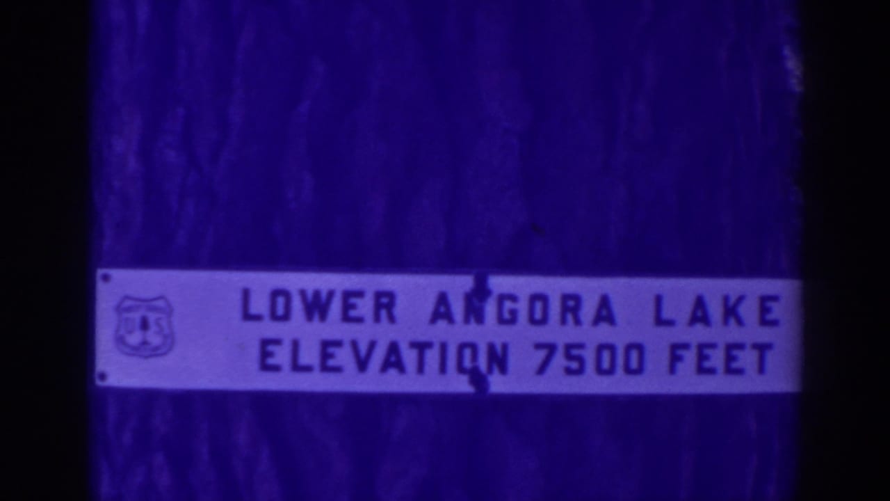 1938 Angora Lakes footage showing a close view of a sign reading Lower Angora Lake elevation 7500 feet.