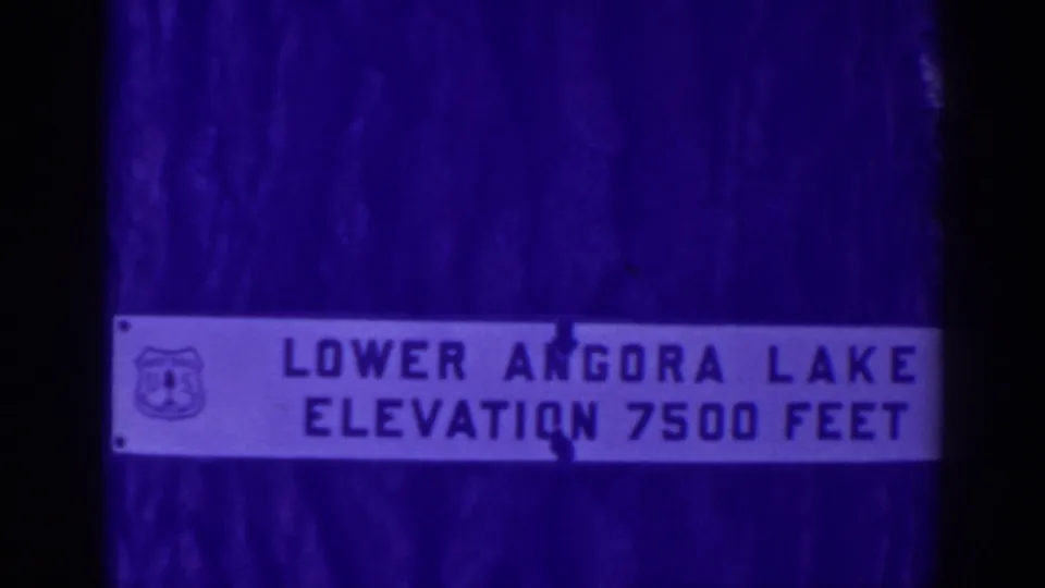 1938 Angora Lakes footage showing a close view of a sign reading Lower Angora Lake elevation 7500 feet.