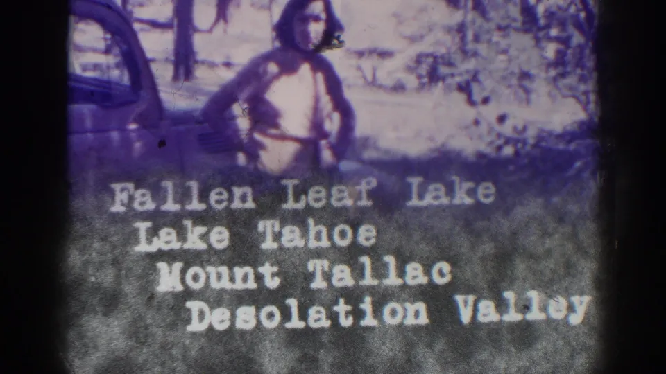 A woman stands near the car as white title text lists Fallen Leaf Lake, Lake Tahoe, Mount Tallac, and Desolation Valley.