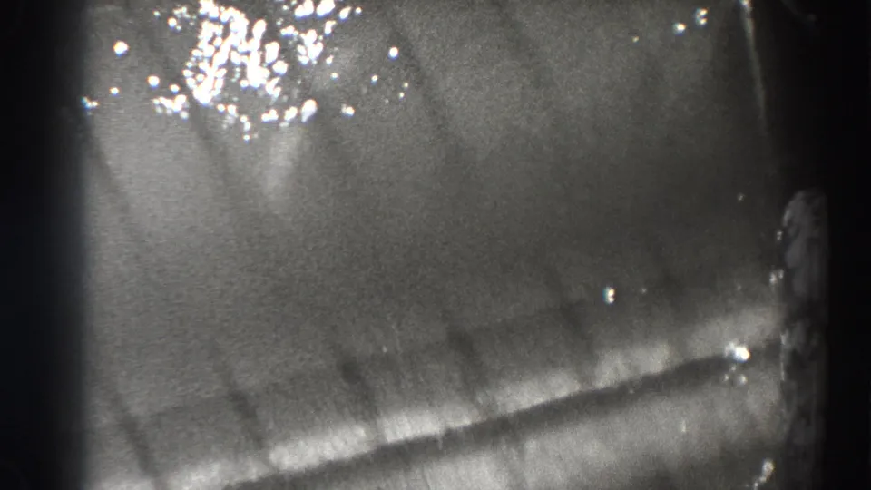 Final close view of Bonneville Dam water movement, with bright highlights and heavy 8mm frame shadowing.