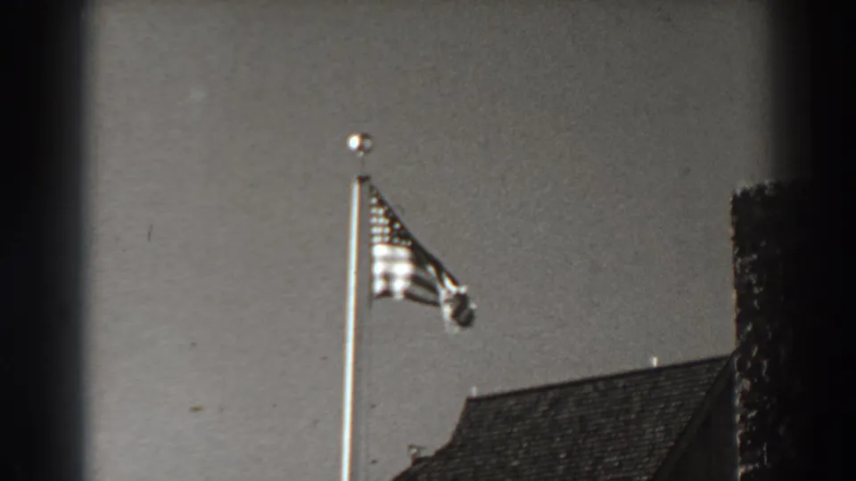 Near the end of the clip, the flag bunches in the wind above the roofline in the 1938 Bonneville Dam home movie.