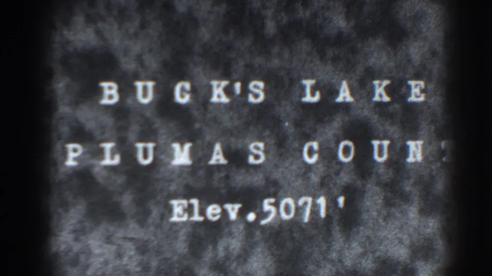 Bucks Lake Plumas County title card from the supplied 1938 8mm clip, with soft focus and dark edges.